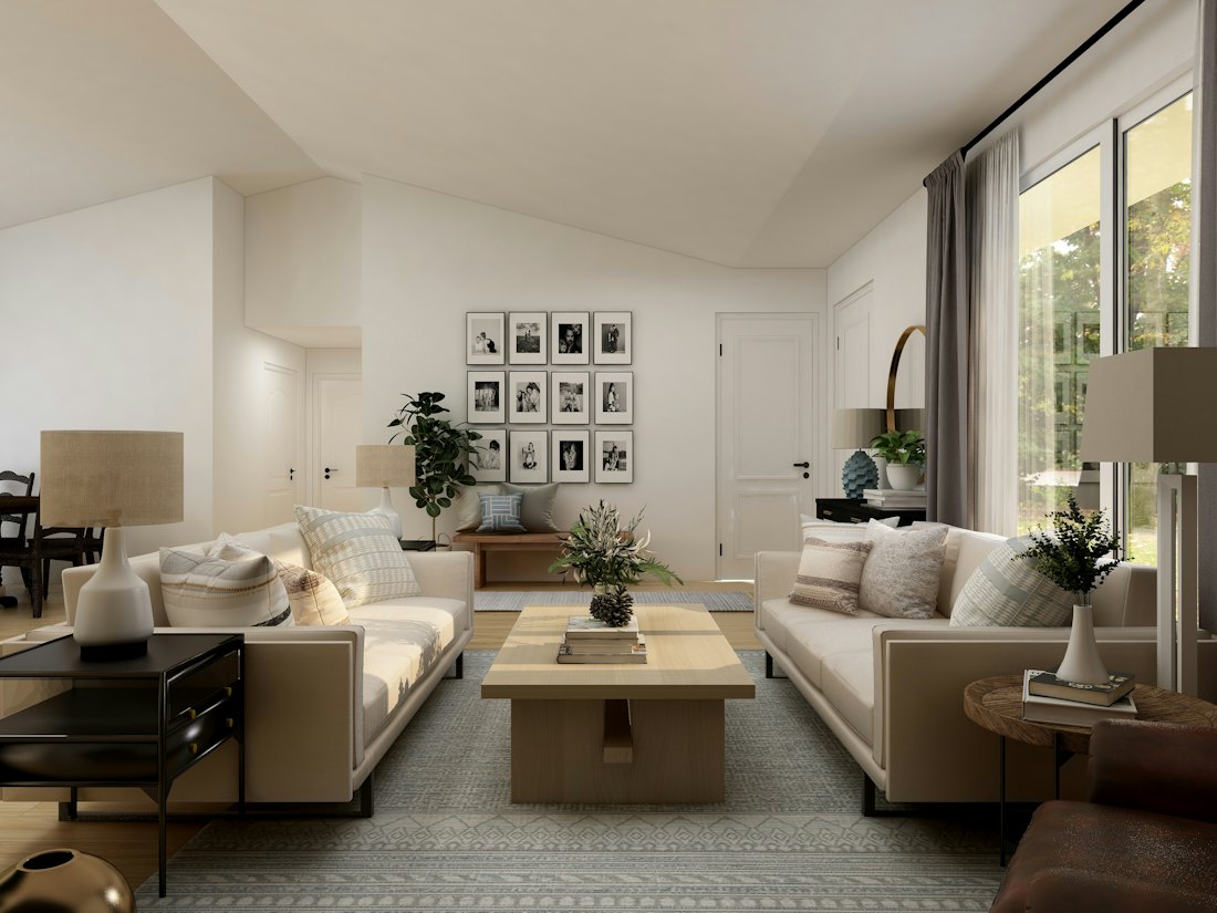 A bright, calm room with a white sofa and a plant